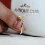 Floral leaf design oval diamond solitaire engagement ring