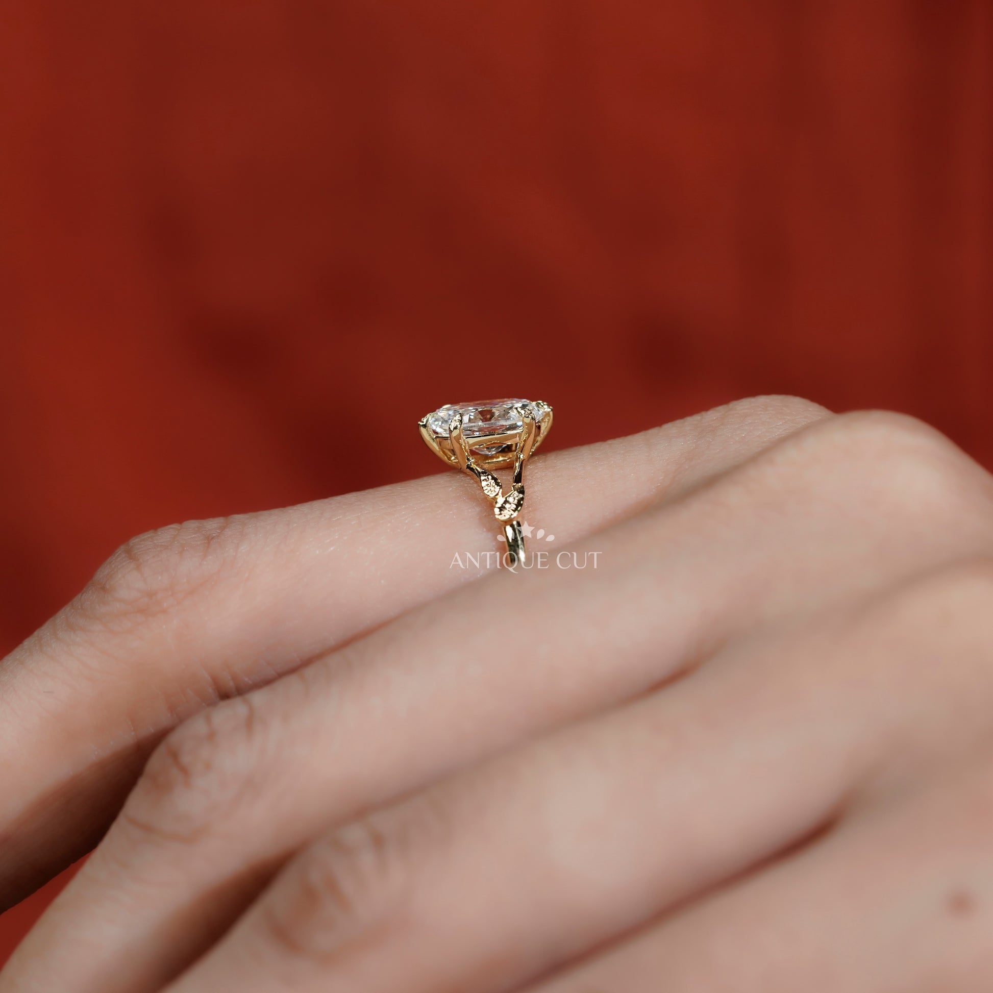Elegant floral leaf engagement ring with oval diamond center