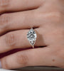 Round diamond ring with vintage inspired side stone design