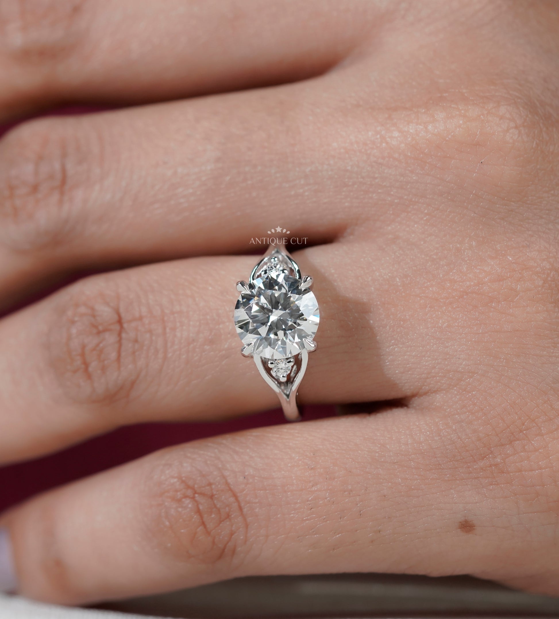 Round diamond ring with vintage inspired side stone design