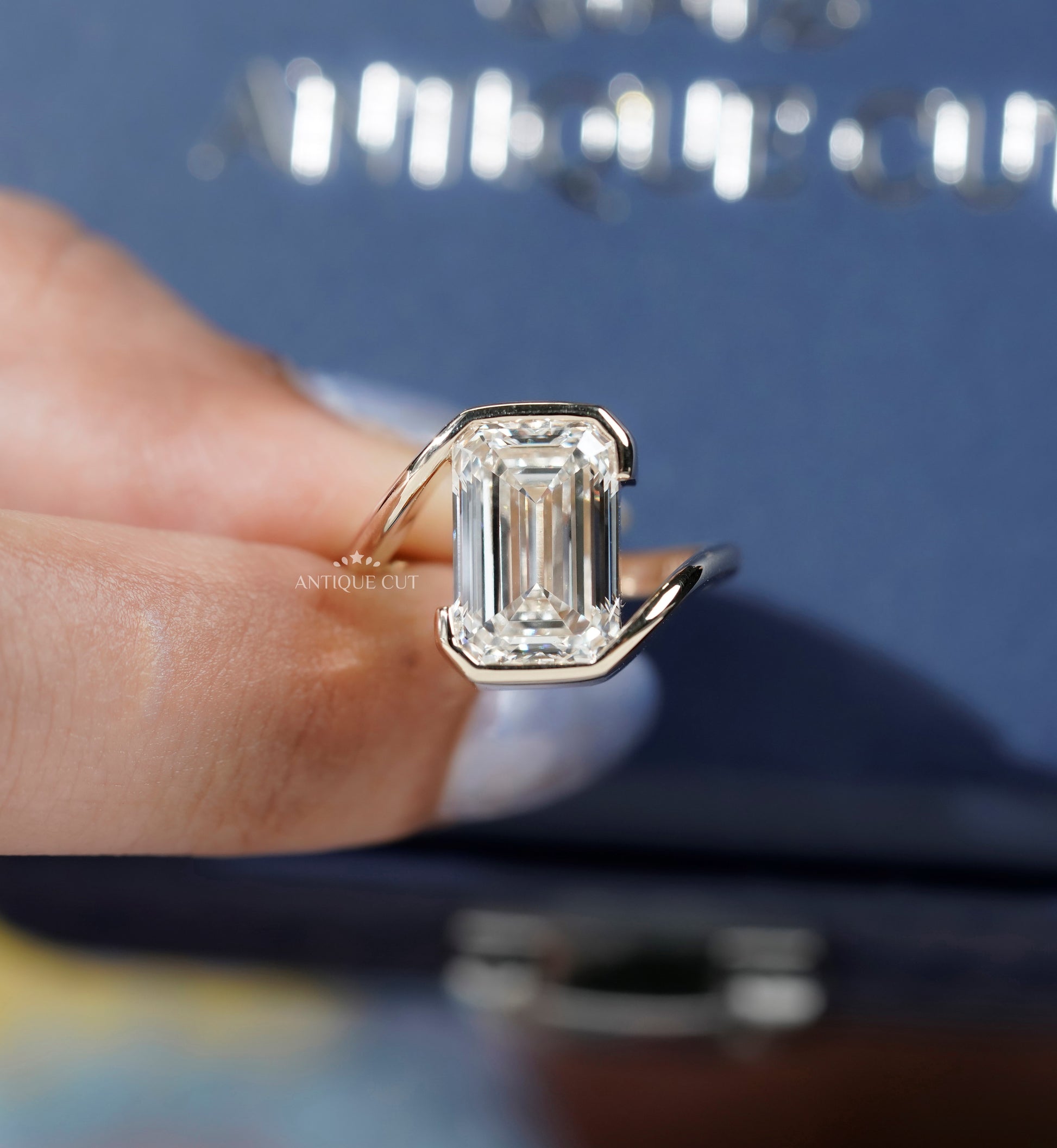 Emerald Cut Engagement Ring with Half Bezel Set