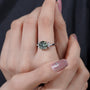 Unique green diamond engagement ring with marquise setting