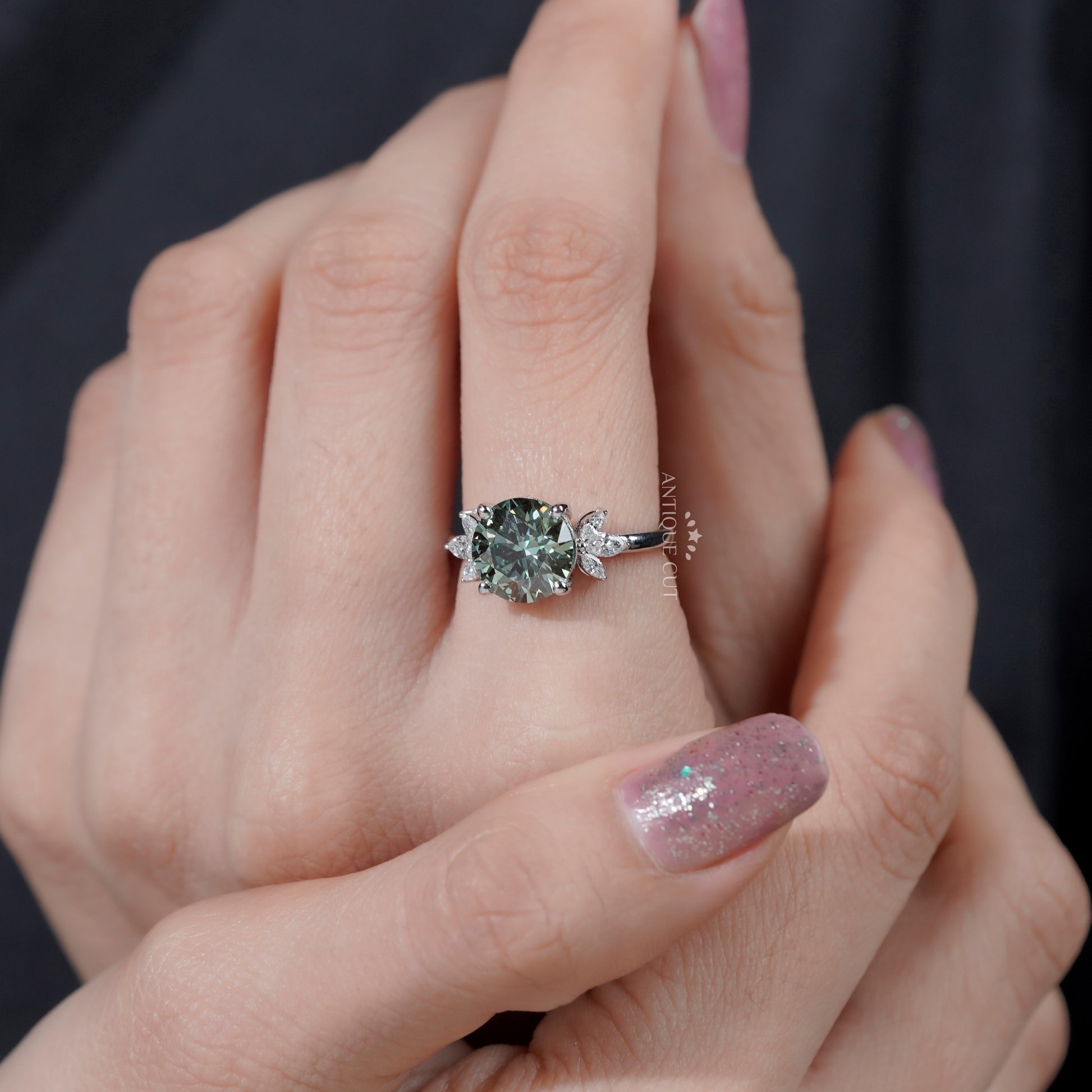 Unique green diamond engagement ring with marquise setting