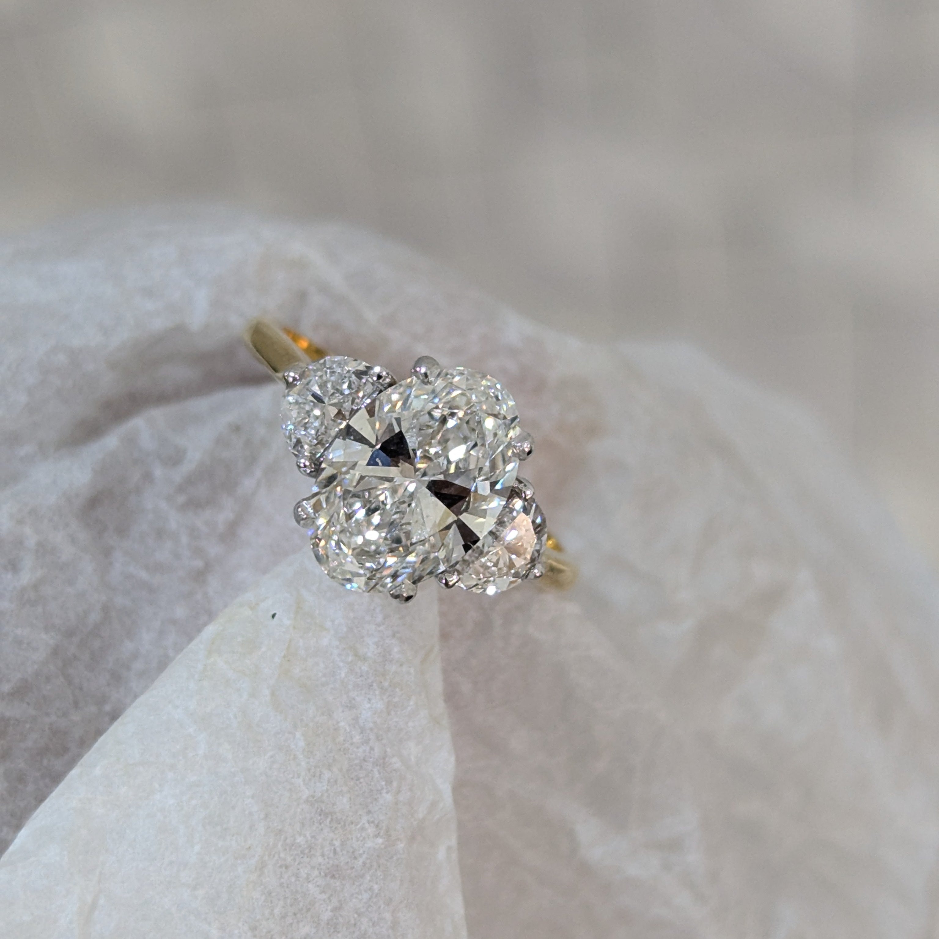 Oval 3.00tcw Lab Grown Diamond Cathedral Two Tone Three Stone Engagement Ring, D-E-F Color, VVS-VS Clarity