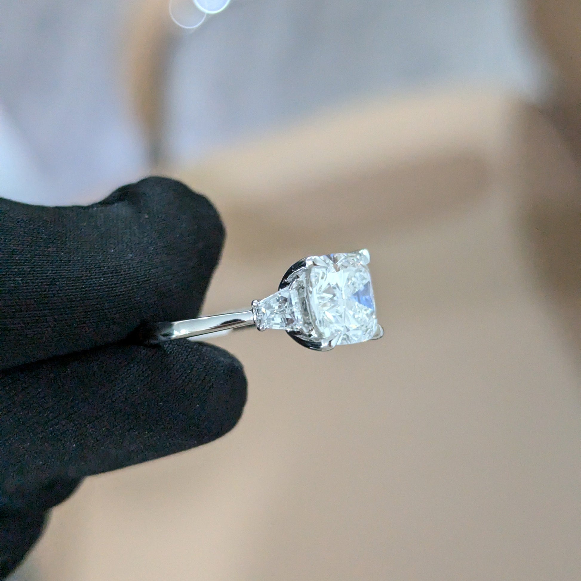 Three Stone 3.50tcw Cushion Lab Grown Diamond Ring | Trapezoid Accents | IGI Certified