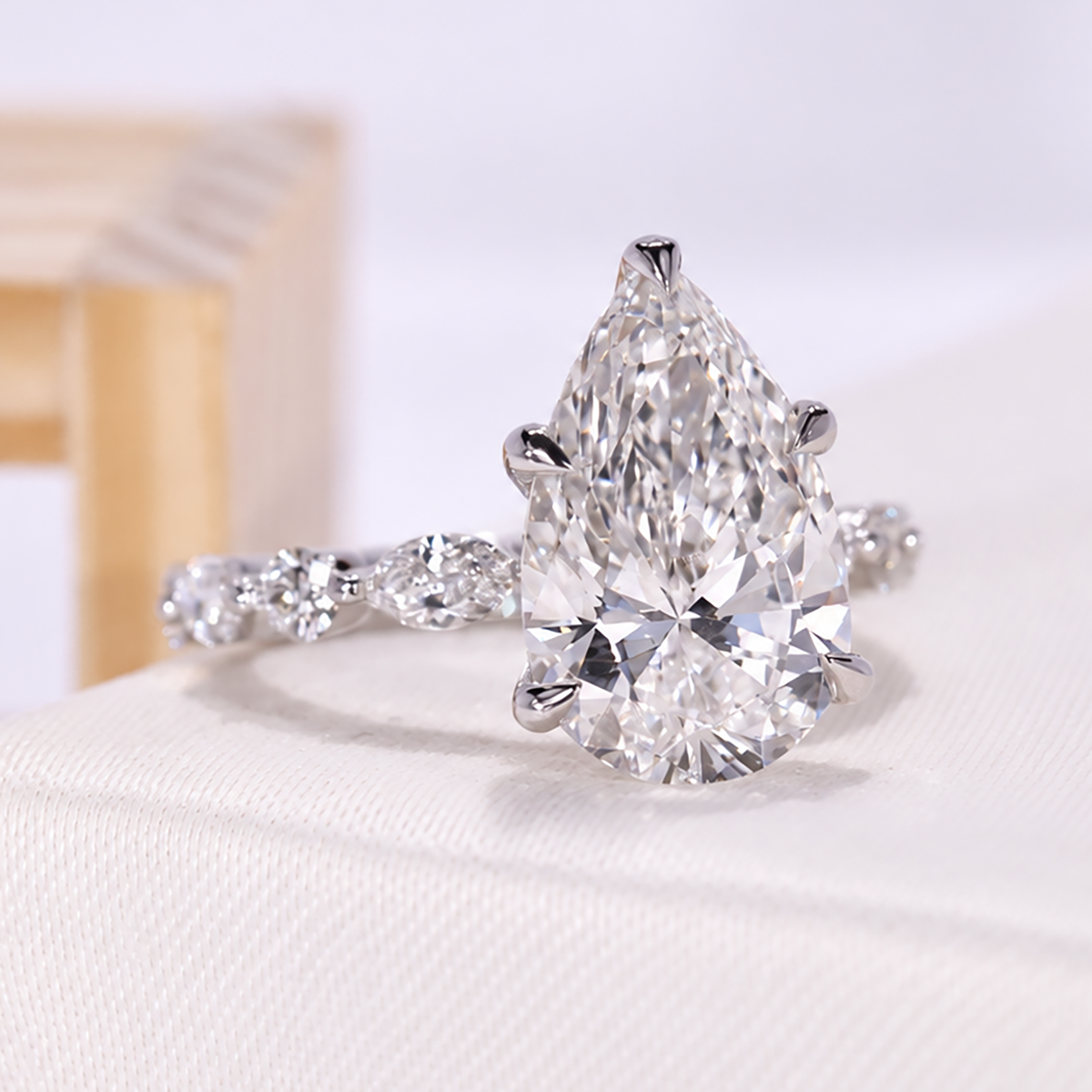 Custom pear lab grown diamond ring with IGI certified center stone