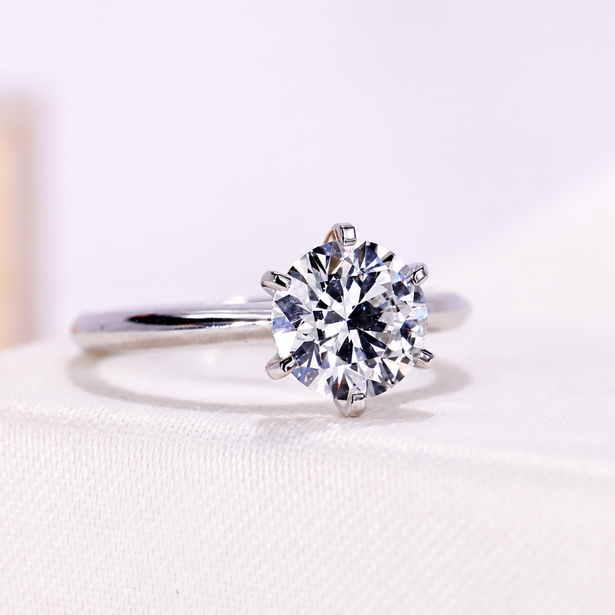 Round lab grown solitaire engagement ring with six prongs