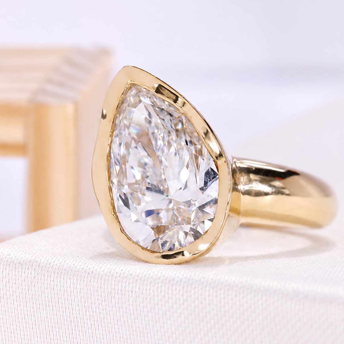 Bezel setting pear diamond ring with lab grown diamond center stone