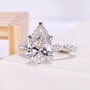 Yellow gold pear engagement ring with lab grown diamond and smooth bezel frame