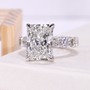 Lab grown diamond ring with radiant cut center stone and detailed side stone setting