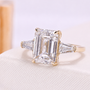 Lab grown emerald cut diamond ring with side stones
