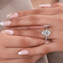 5.00 carat lab grown diamond ring with pear cut center and yellow gold setting