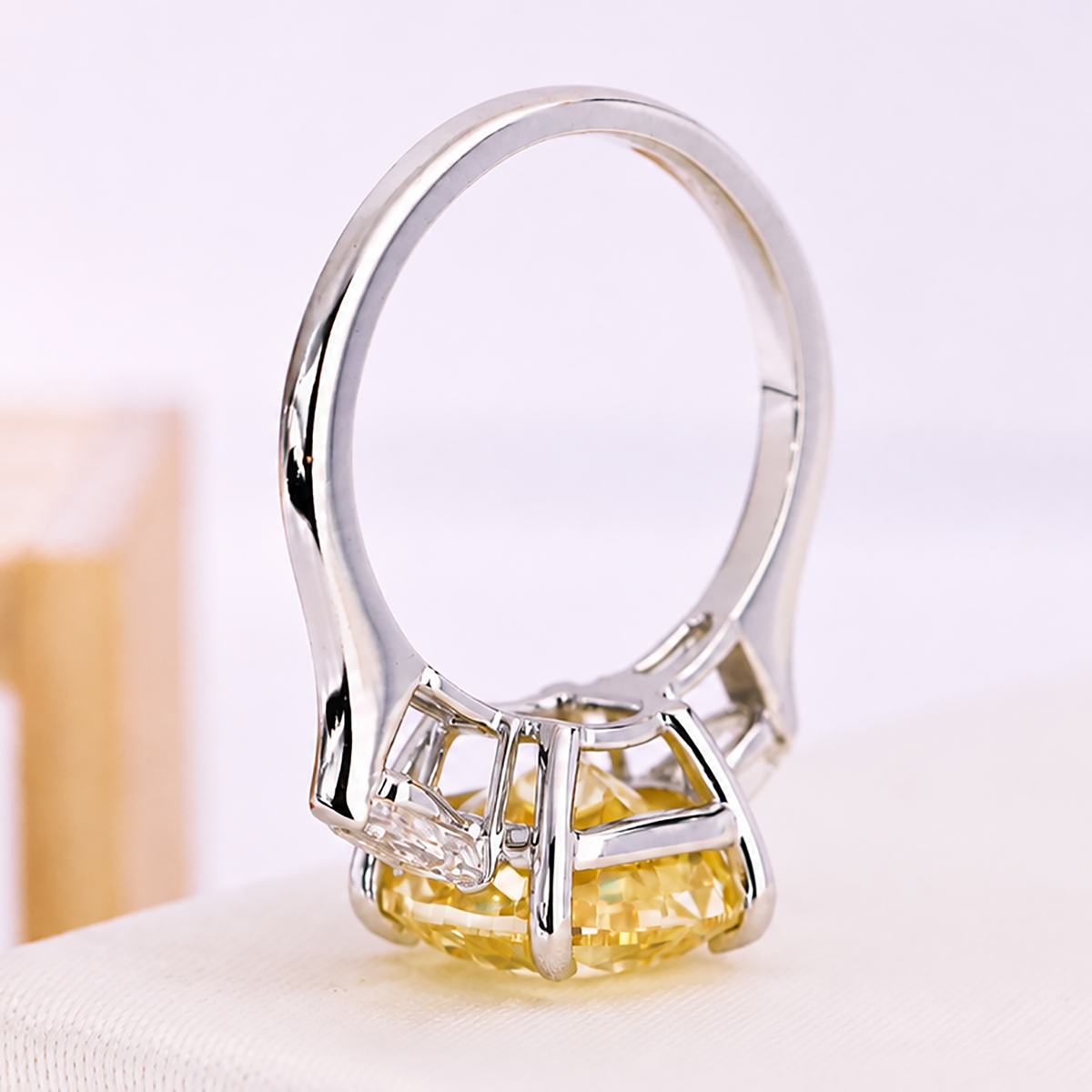 White gold cushion cut engagement ring with yellow diamond