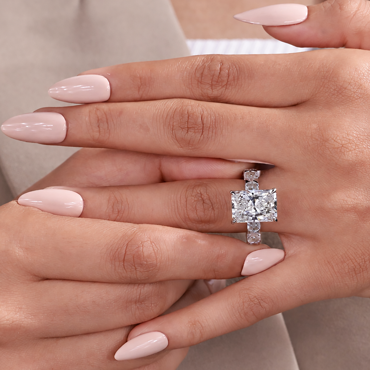Radiant cut engagement ring with lab grown diamond and matching side stone design