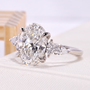oval cut diamond ring with marquise and pear cut side stone