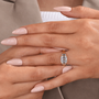 Asscher cut engagement ring with three diamond stones