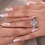 four claw prong with oval cut diamond ring
