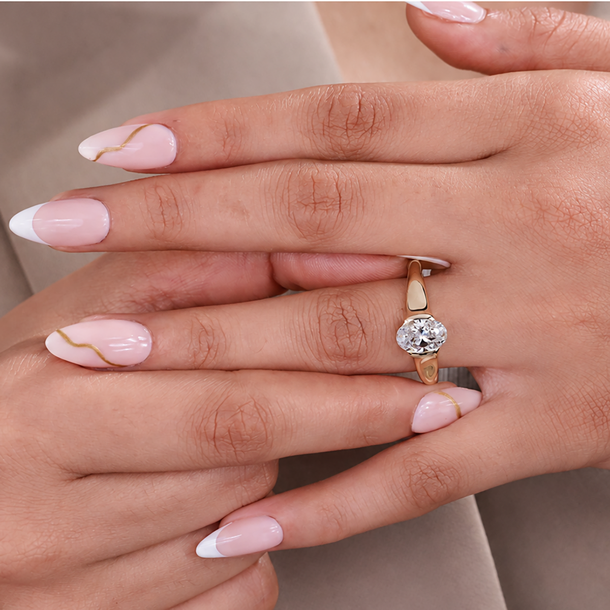 Half bezel yellow gold setting with oval center diamond engagement ring