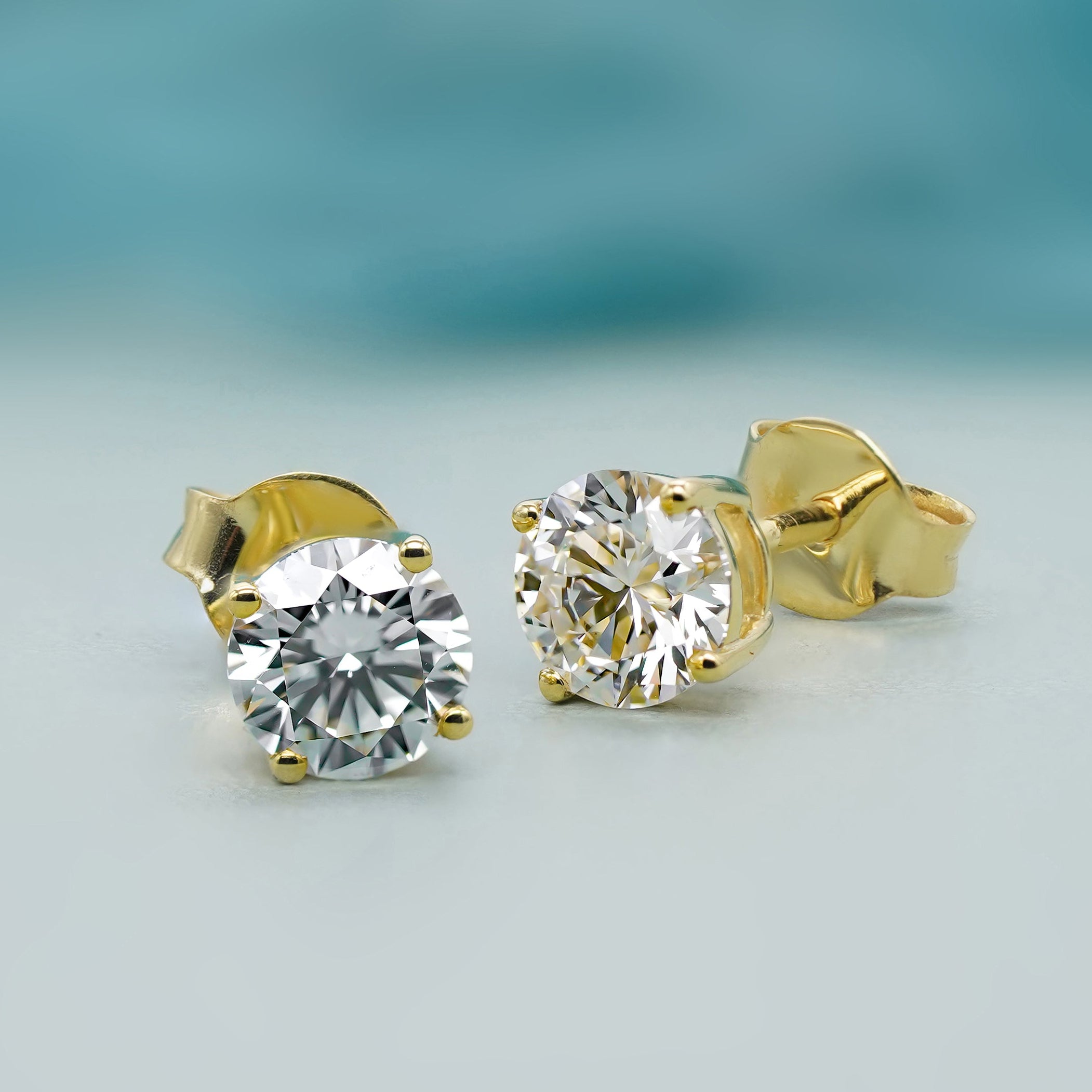 Round lab grown diamond stud earrings in yellow gold