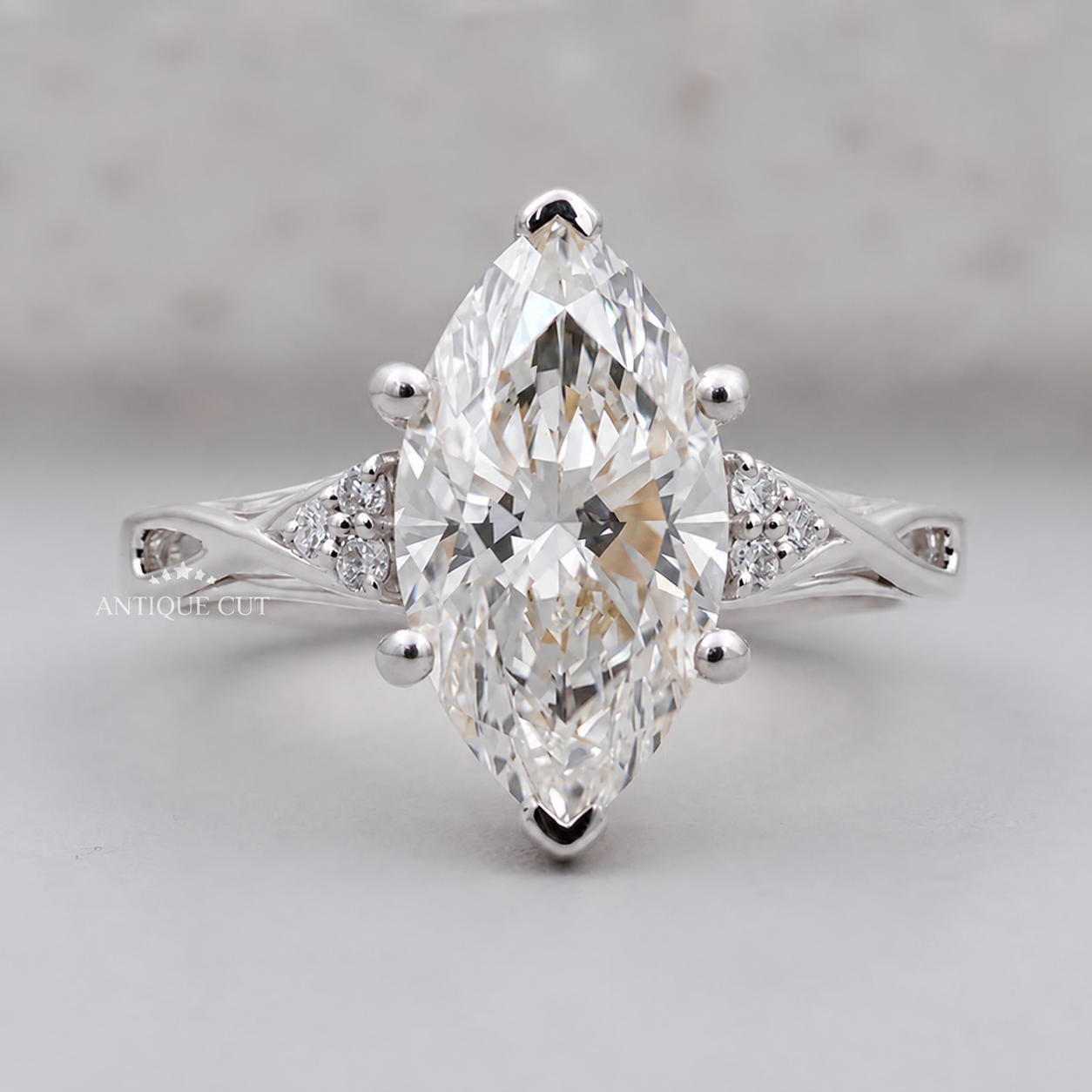 White gold ring featuring a large marquise cut diamond