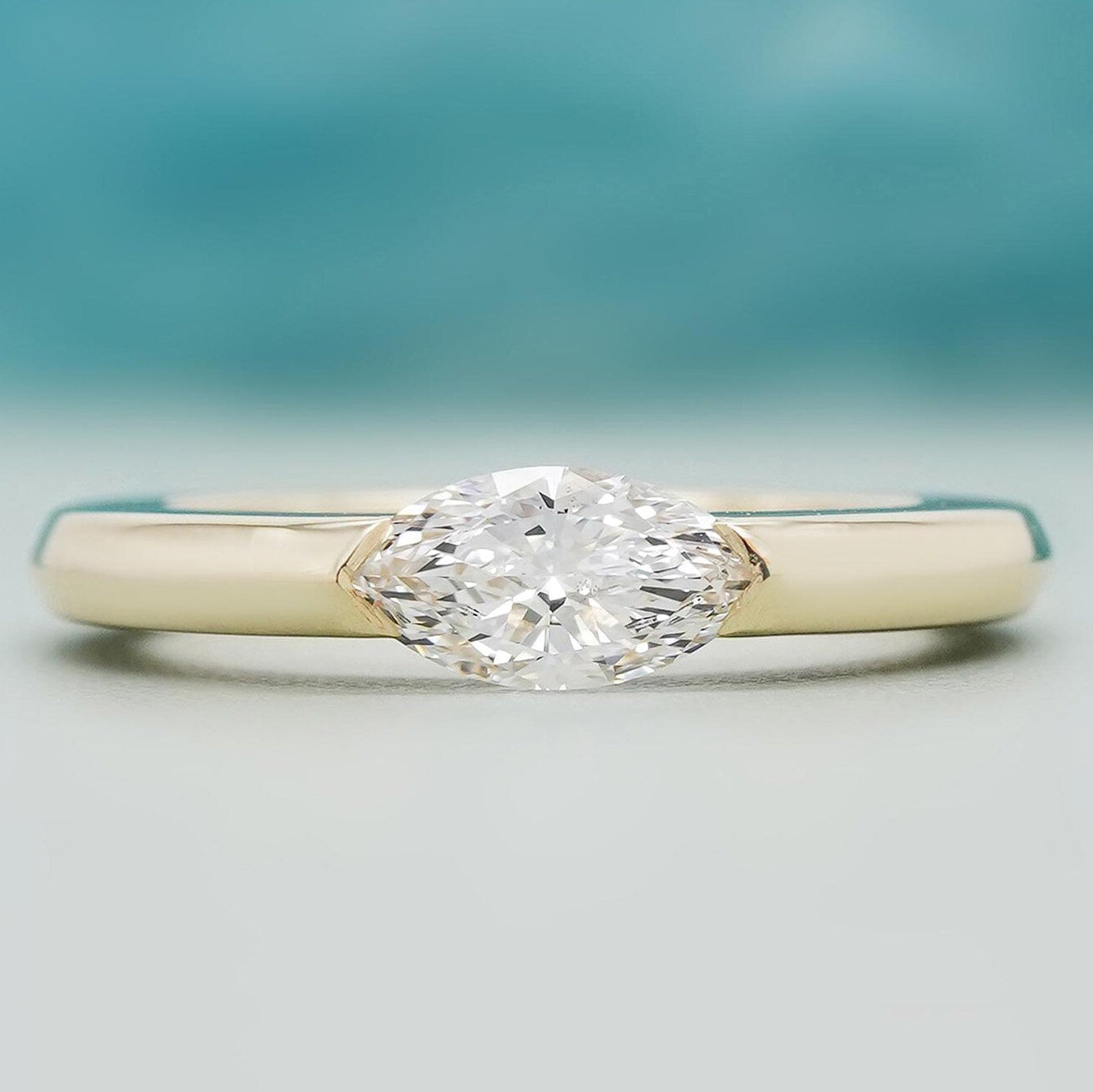 East west marquise engagement ring yellow gold