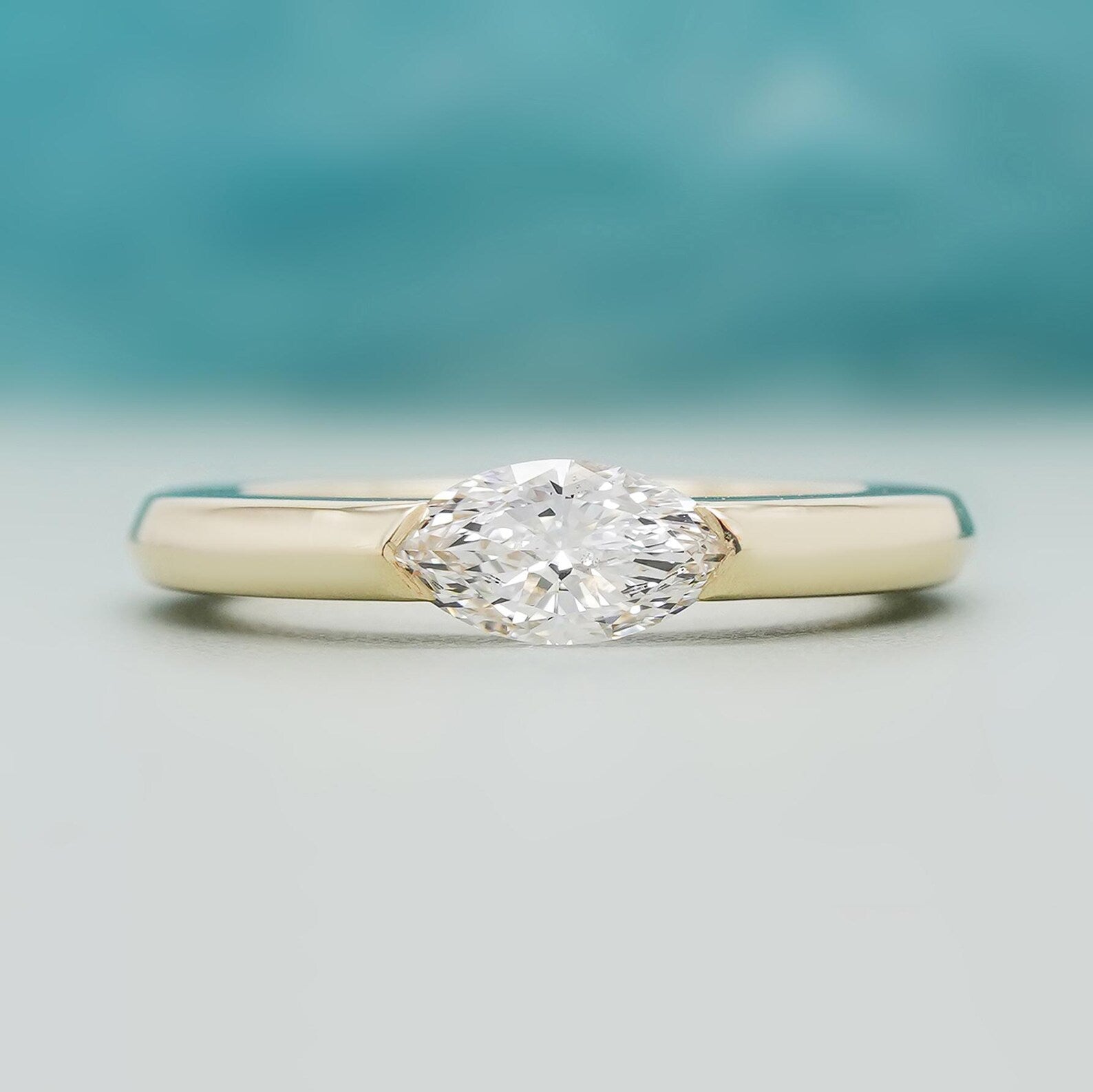 East West Marquise Solitaire Engagement Ring With Half Bezel Ring | IGI Certified