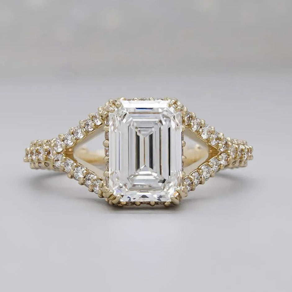 Split shank emerald cut engagement ring in white gold