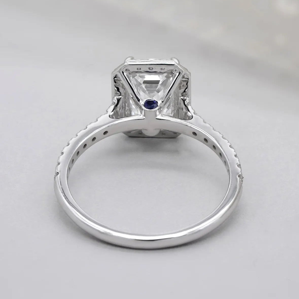 Lab grown diamond emerald cut halo engagement ring
