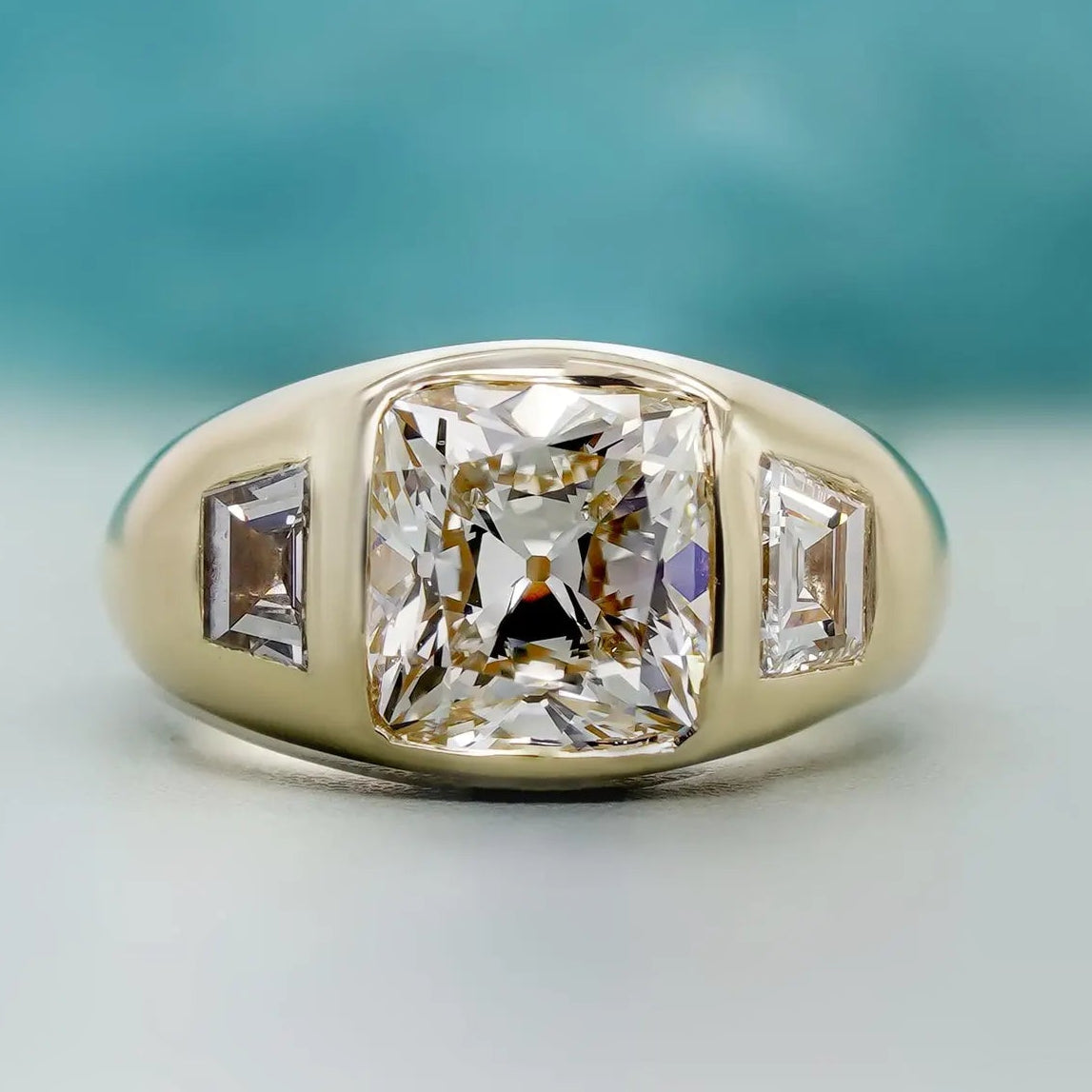 Old mine cushion cut diamond ring in yellow gold