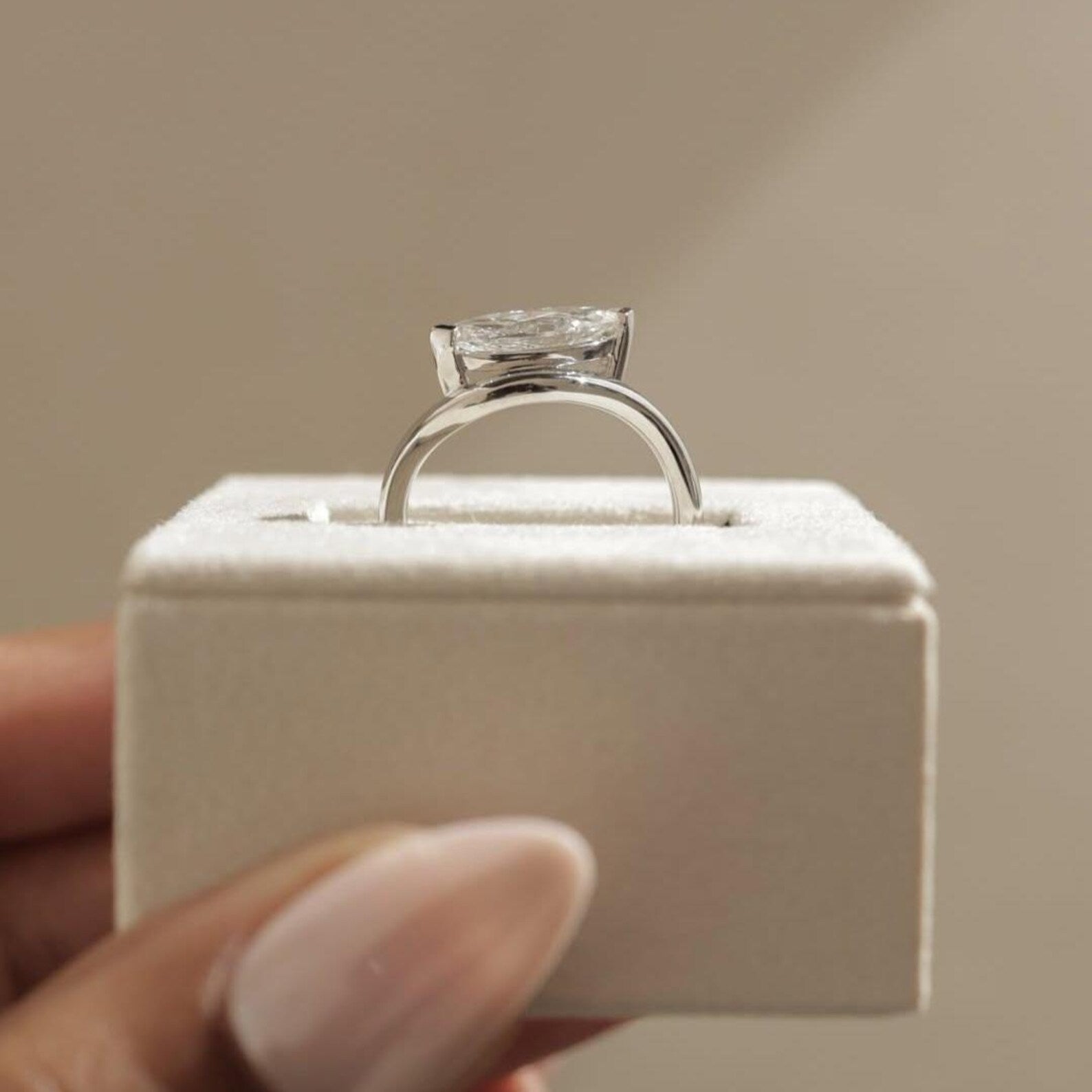 Yellow gold ring with east-west marquise diamond