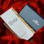 IGI diamond report card and a blue jewelry box on red fabric

