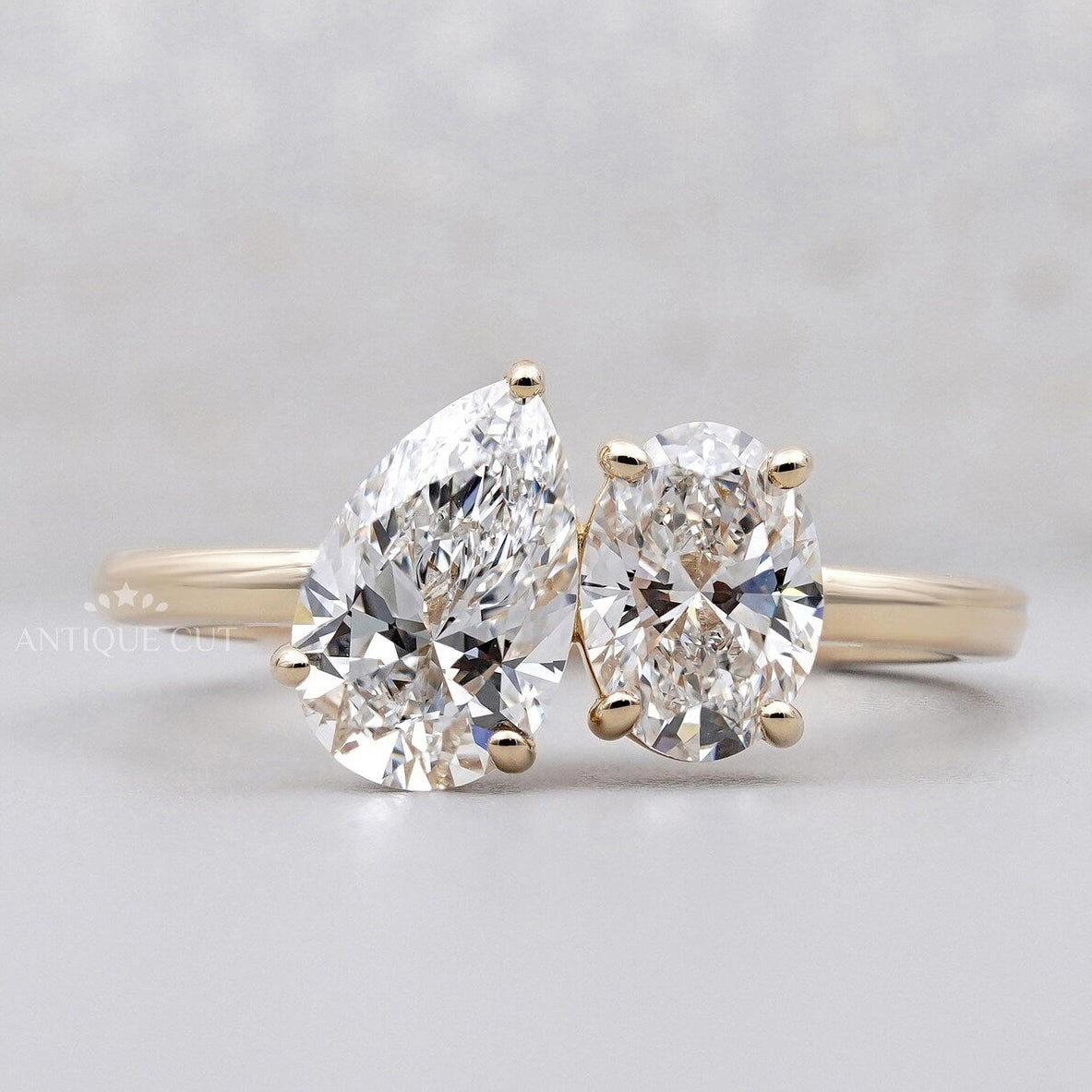 Oval and pear Toi Et Moi engagement ring in yellow gold