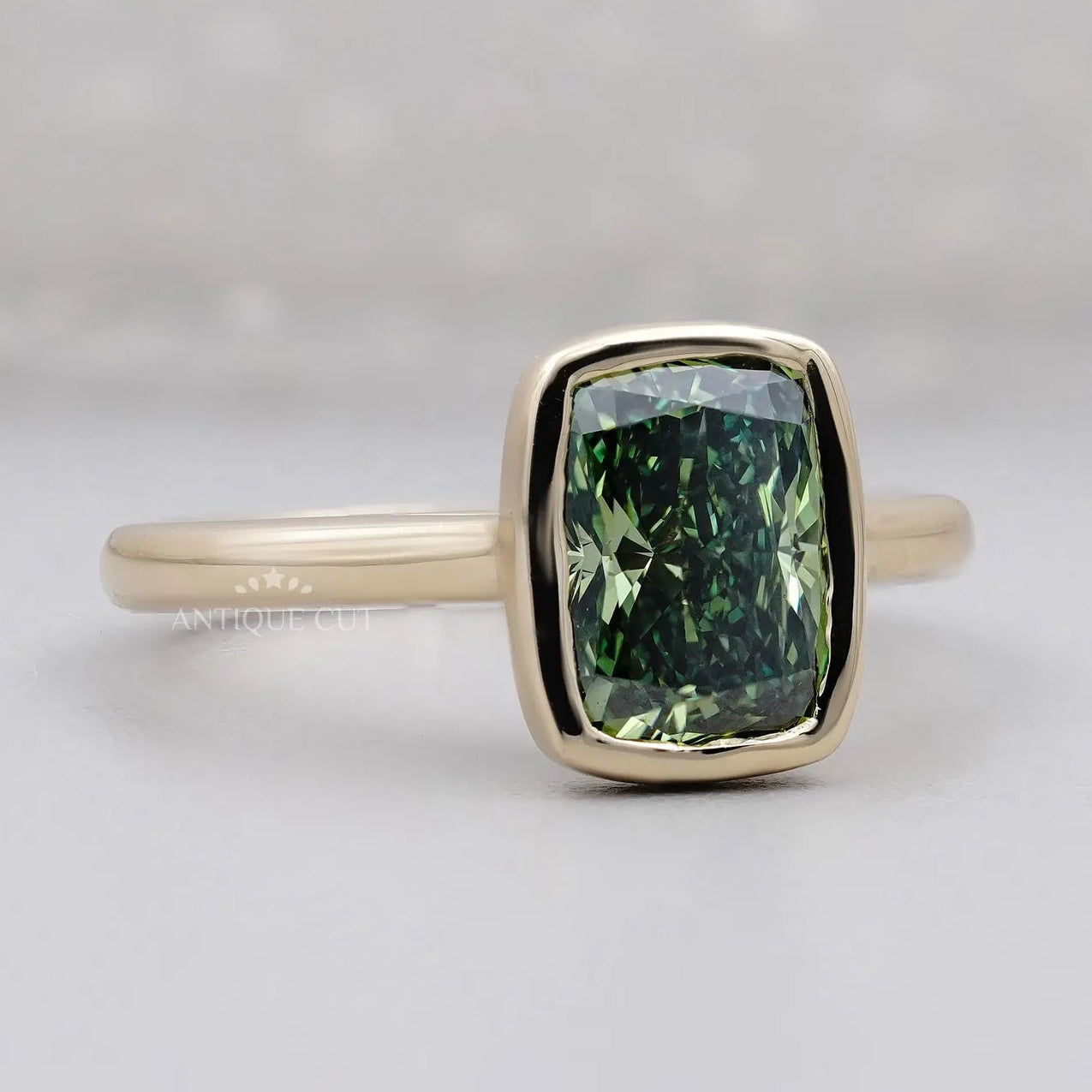 Yellow gold green cushion diamond engagement ring