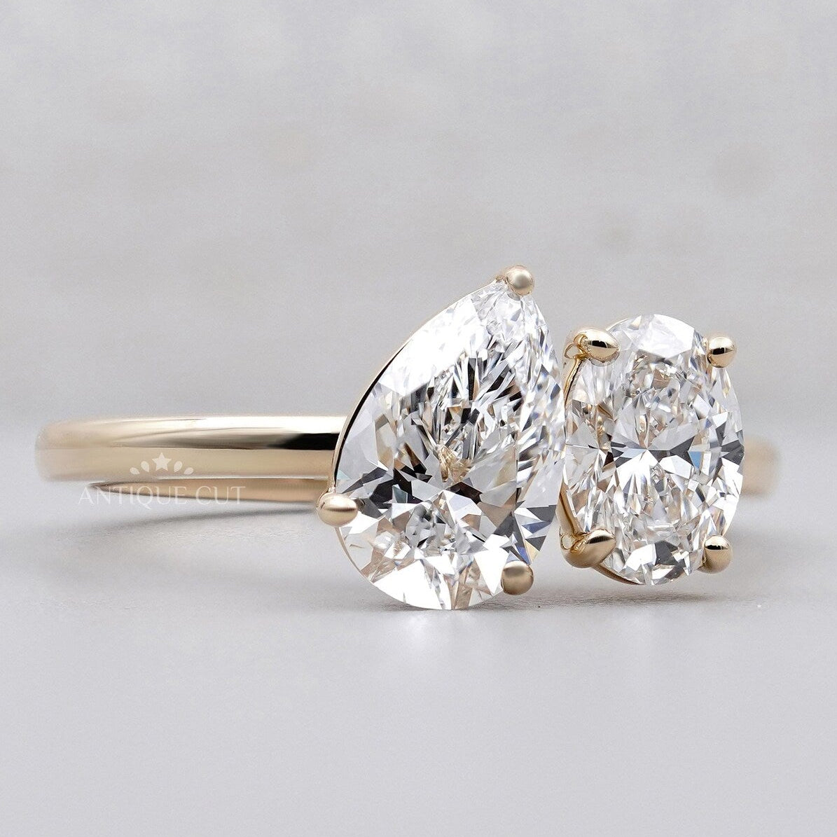 Antiquecut oval and pear engagement ring in gold