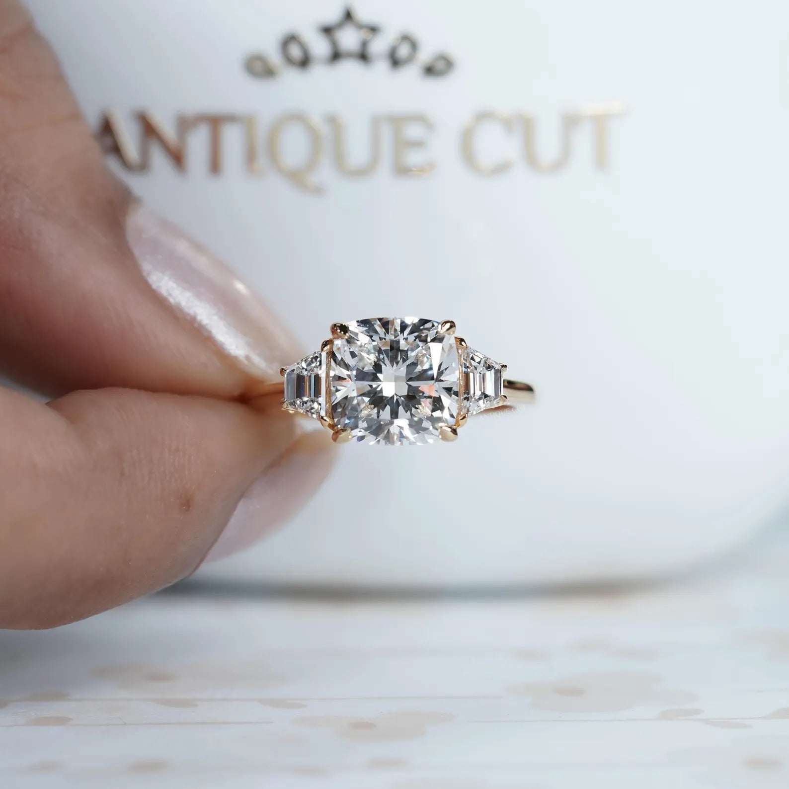 Cushion cut lab grown diamond ring with baguette