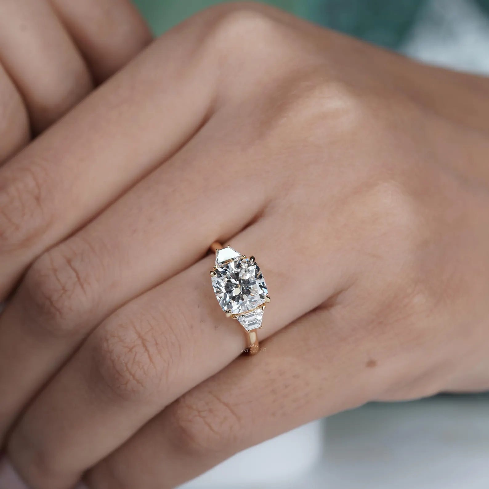 Custom made lab grown cushion cut ring with baguette accents