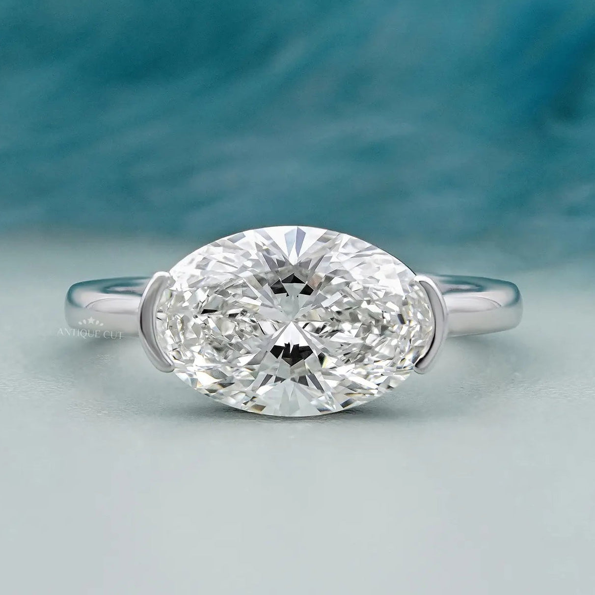 East west oval diamond engagement ring in white gold