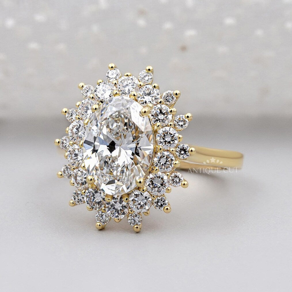 Oval cut gold wedding ring with double halo