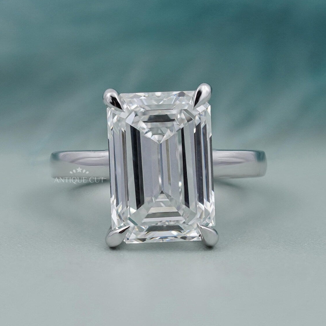 Emerald cut engagement ring with solitaire diamond in white gold