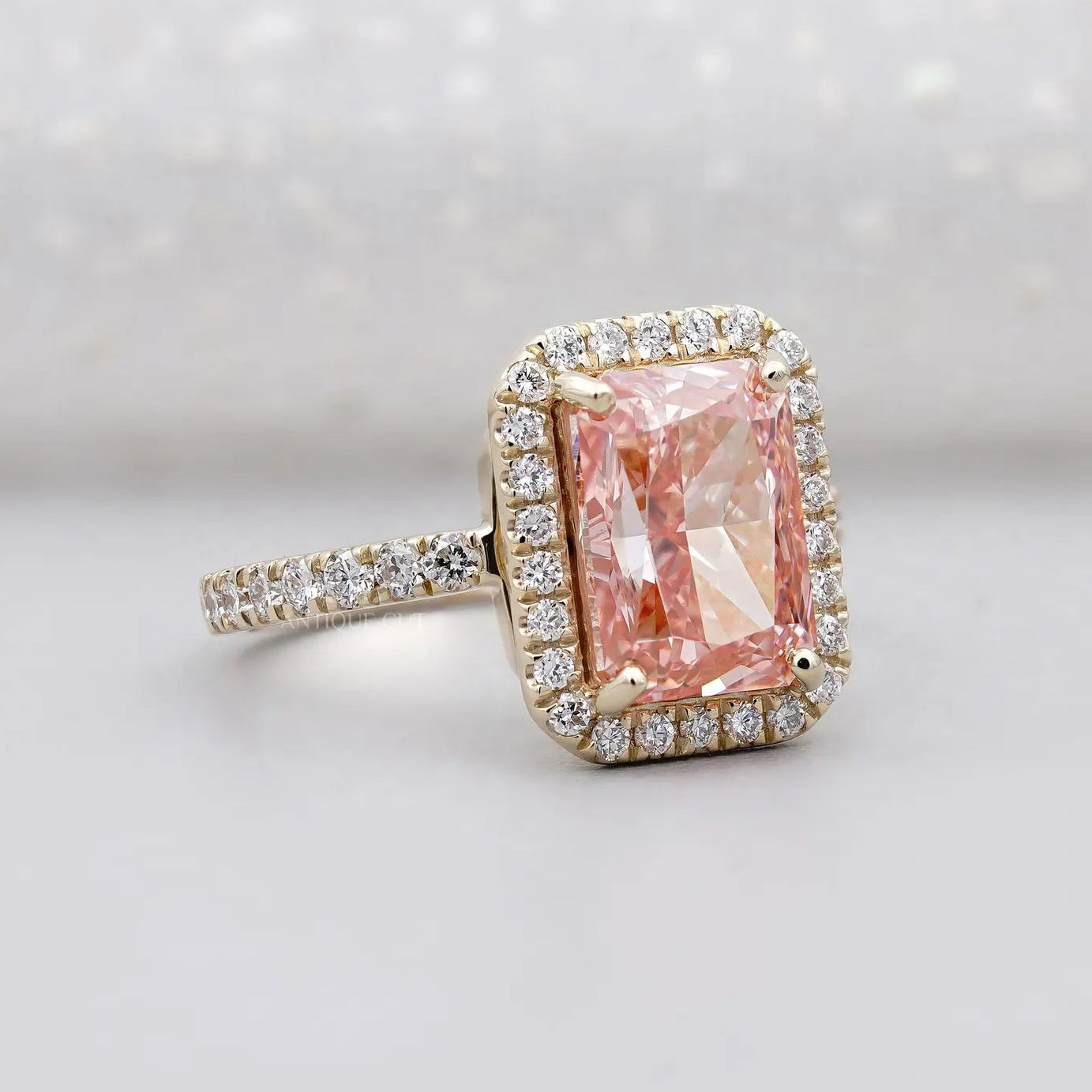 Fancy Pink Radiant Cut Diamond Ring With Halo Setting And Pave Band | IGI Certified