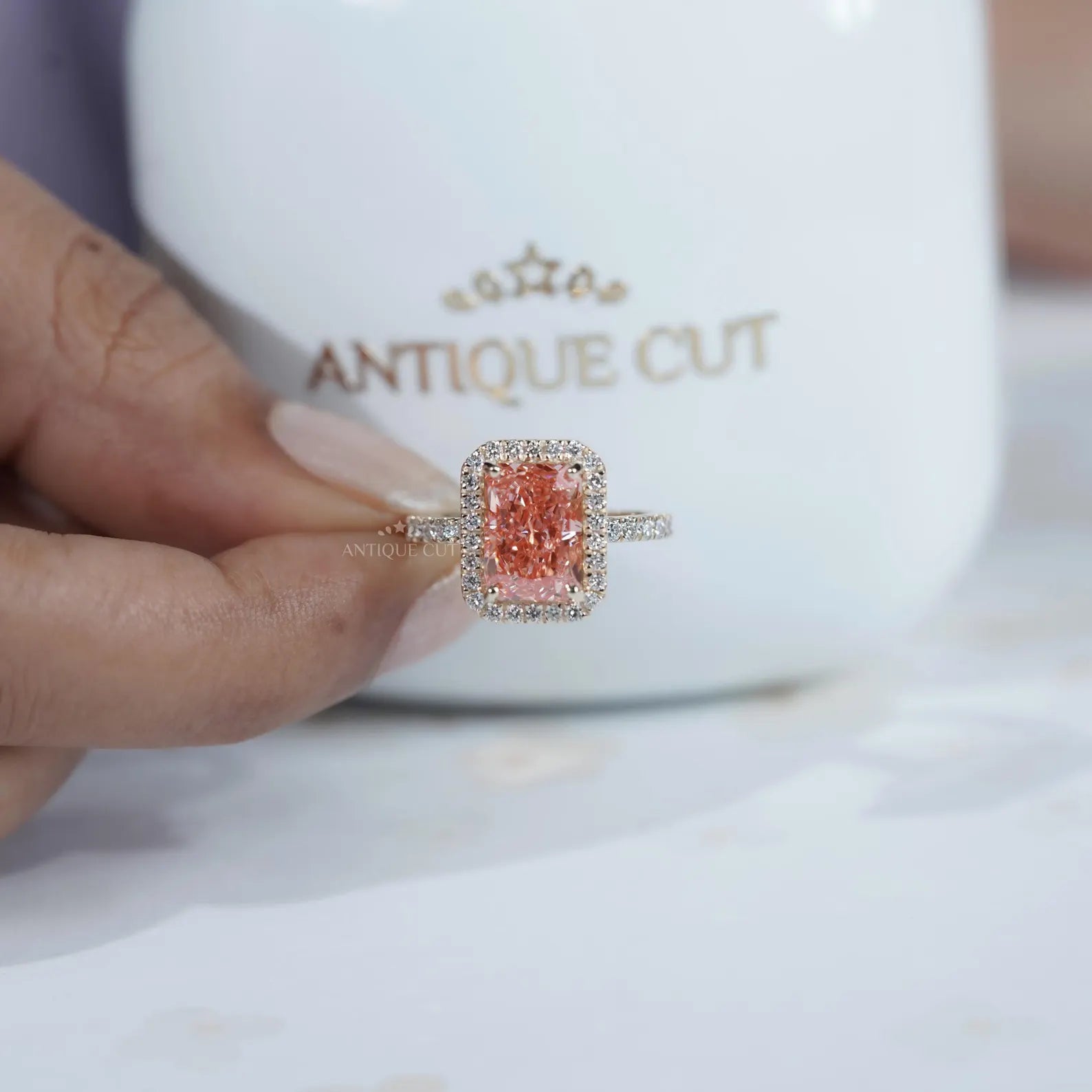 Fancy Pink Radiant Cut Diamond Ring With Halo Setting And Pave Band | IGI Certified