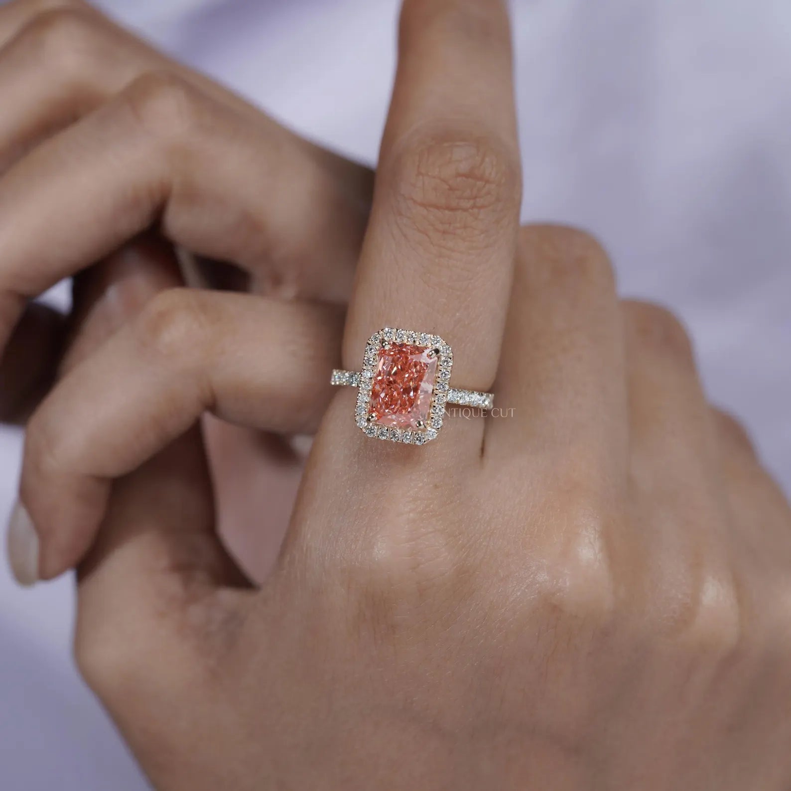 Fancy Pink Radiant Cut Diamond Ring With Halo Setting And Pave Band | IGI Certified