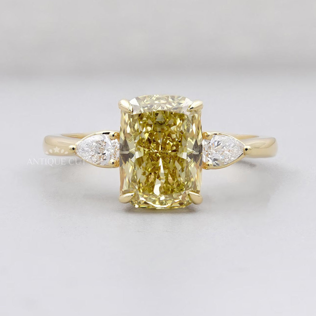 Yellow cushion diamond ring three stone yellow gold 4 prong