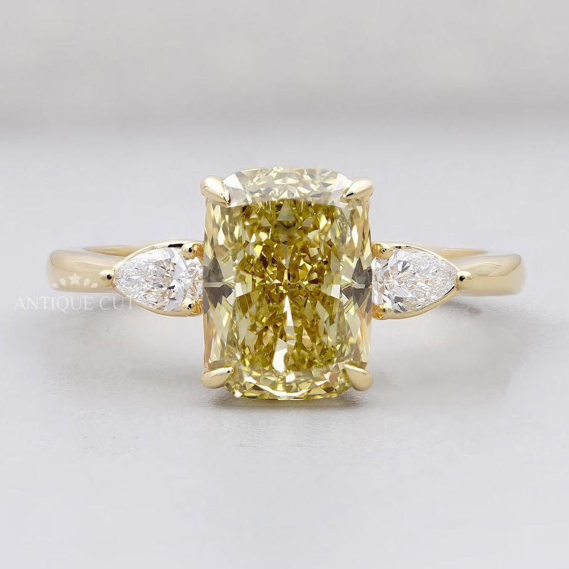 Yellow cushion diamond ring three stone yellow gold 4 prong