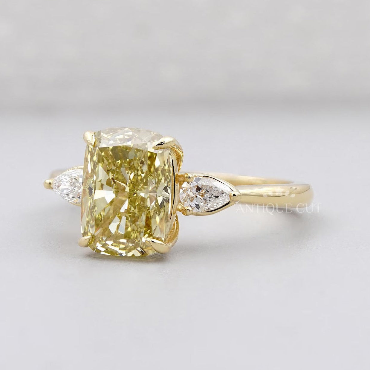 Lab grown yellow cushion diamond ring three stone gold