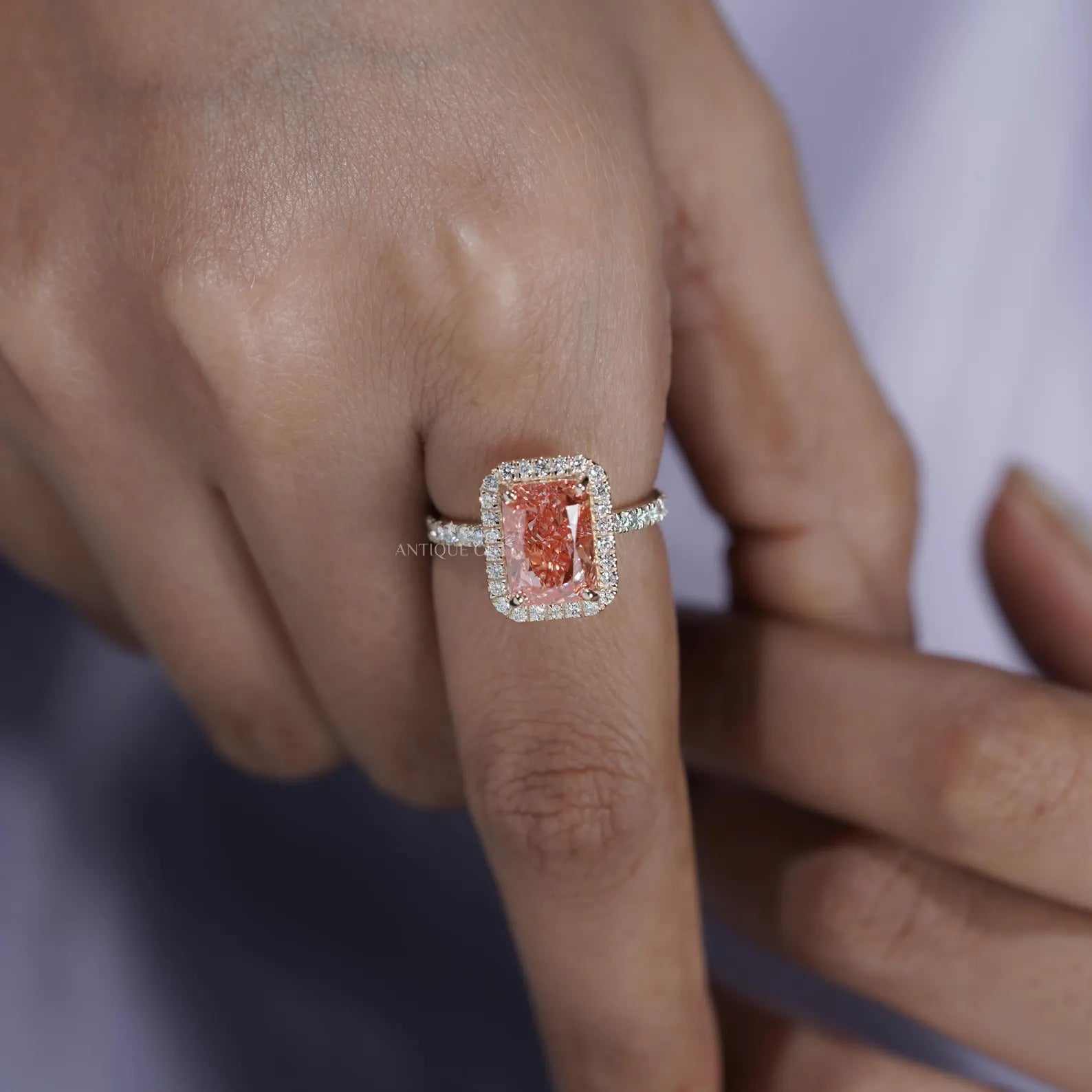 Fancy Pink Radiant Cut Diamond Ring With Halo Setting And Pave Band | IGI Certified