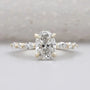 Oval cut wedding ring with marquise side stones