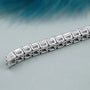 Diamond bracelet on a gradient blue and gray background