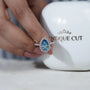 Lab grown teardrop diamond ring with three round prongs