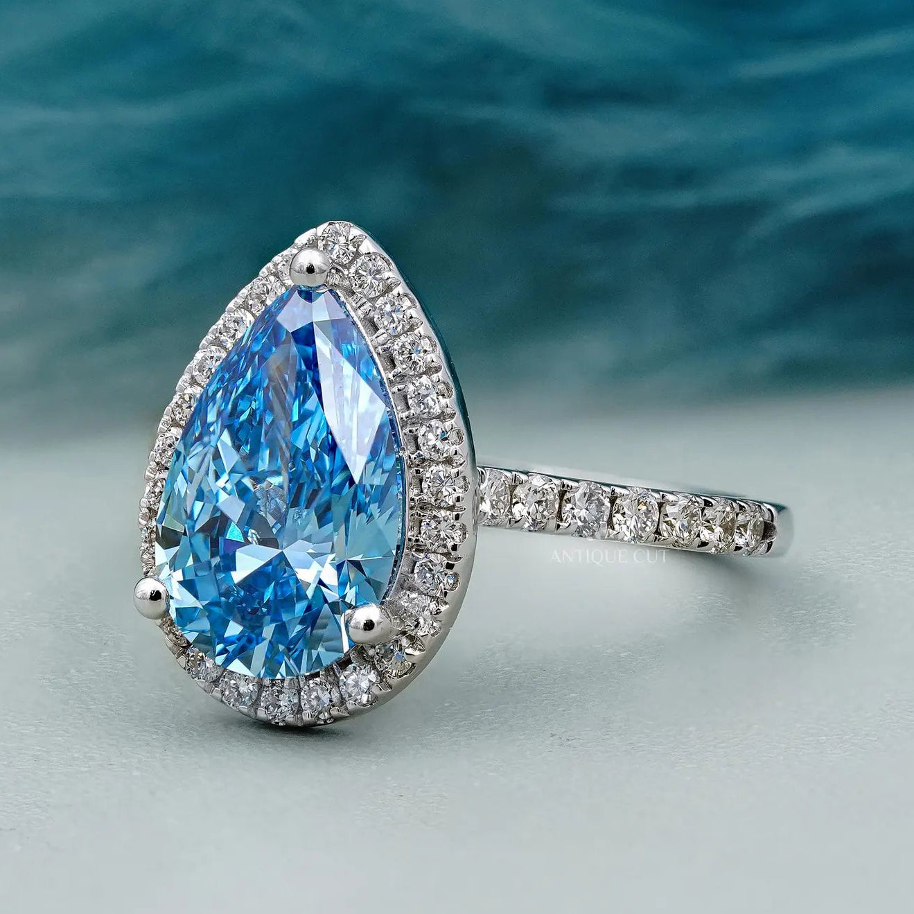 Lab grown teardrop shaped diamond ring with halo setting